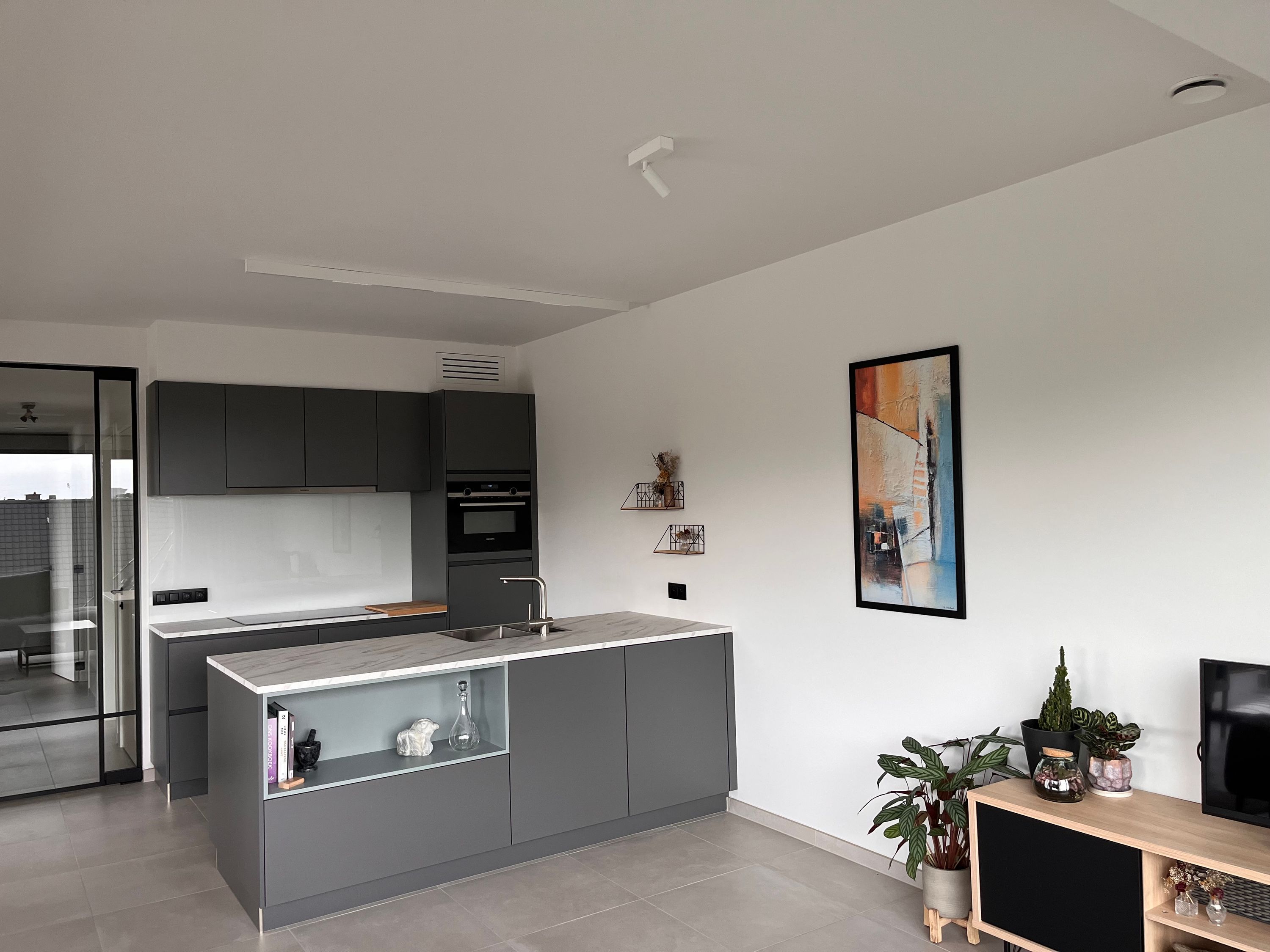 Lichtrijk recent gebouwd appartement met oost-zuidgericht terras - foto 4